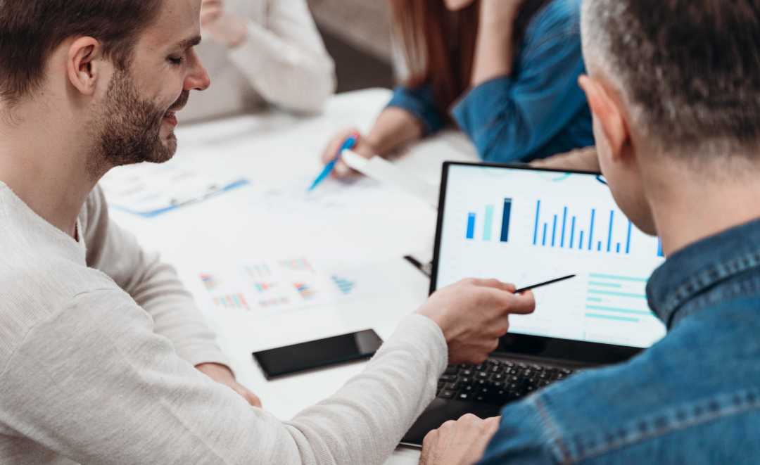 Team member presenting analytics on a large screen